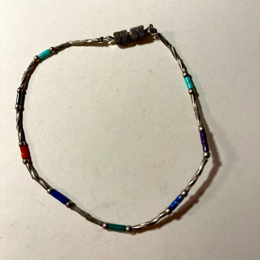 Wire bracelet with blue and pink beading. #681